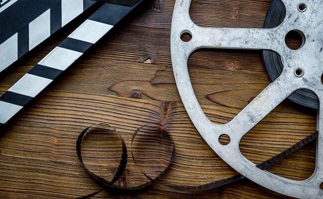 Cinema,And,Filmmaker,Concept,With,Film,Reels,And,Clapperboard.