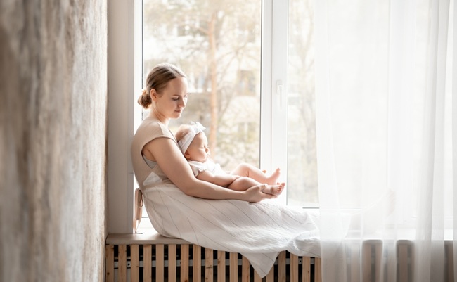 Mom,And,Baby,,Mother,Gently,Hugs,Her,Baby,Sitting,At