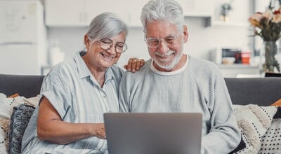 House,,Laptop,And,Senior,Couple,On,Sofa,,Finance,Planning,Or