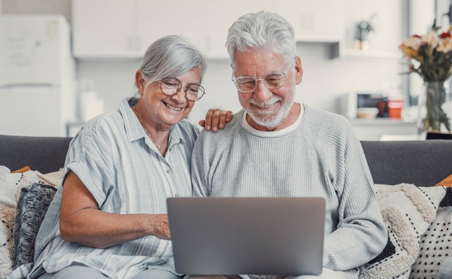 House,,Laptop,And,Senior,Couple,On,Sofa,,Finance,Planning,Or