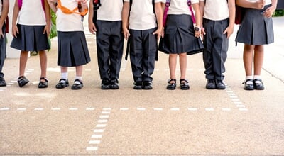 A,Group,Of,Children,In,School,Uniforms,,Standing,In,A