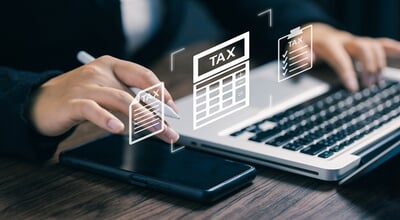 Business,Professional,Managing,Tax,Documents,And,Financial,Accounting,On,Laptop,