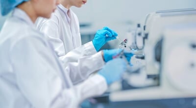 Histology,Technician,Cutting,Tissue,Section,With,Rotary,Microtome.,Female,Scientist